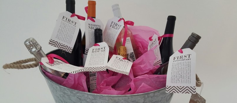 A cocktail themed basket of wedding shower gifts