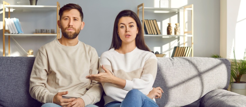 Young couple discussing family crisis