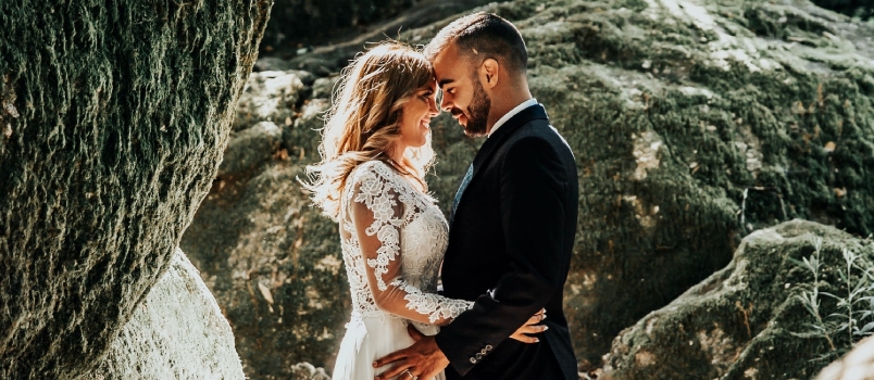 bride and groom holding each other