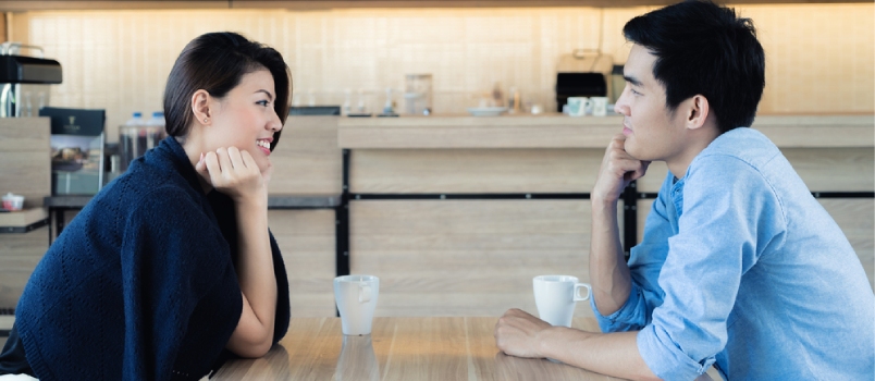 Wonderful Couple Communicating Together With The Cup Of Coffee In The Cafe