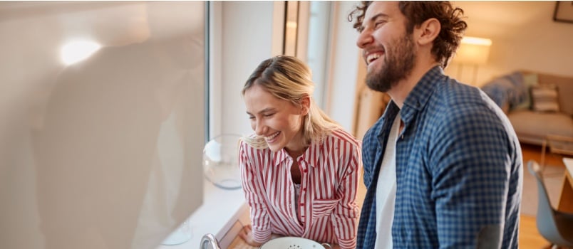 Loving couple doing dishes