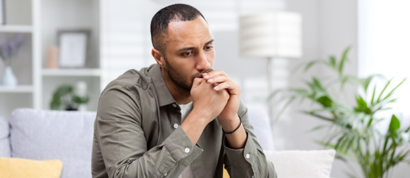 Depressed man sitting alone