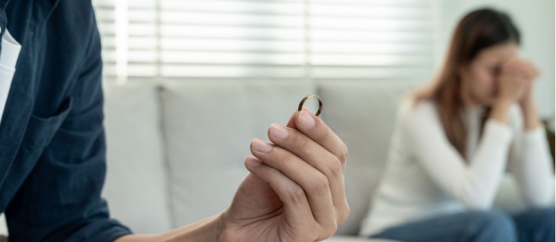 Husband giving back the wedding ring