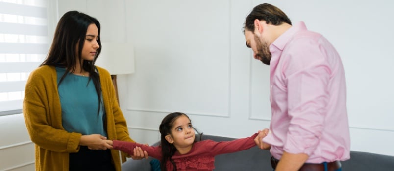 Couple pulling the kid