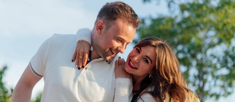 Woman hugging man from back