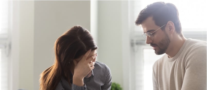 Man comforting sad wife