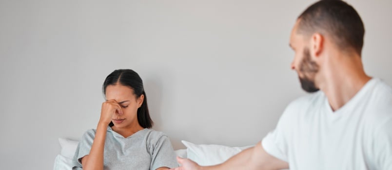 Man comforting sad woman