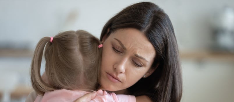 Woman hugging her daughter