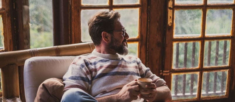 Old mature man sitting on chair