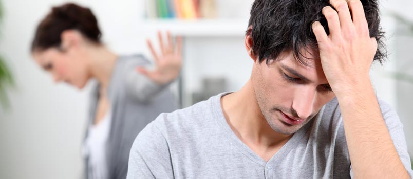 wife disappointed with sad husband