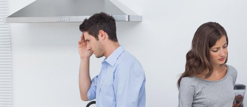 Sad Couple Back to Back In Living Room