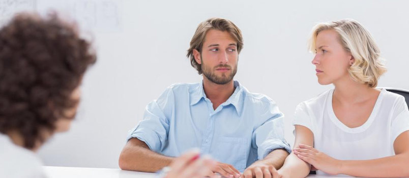 Man And Women Meeting Therapist In His Office