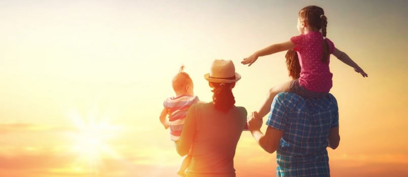 Family facing toward sun