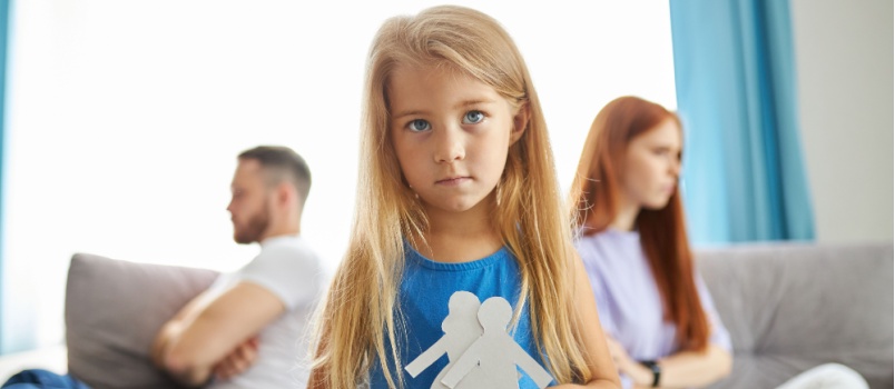 Little girl holding paper doll