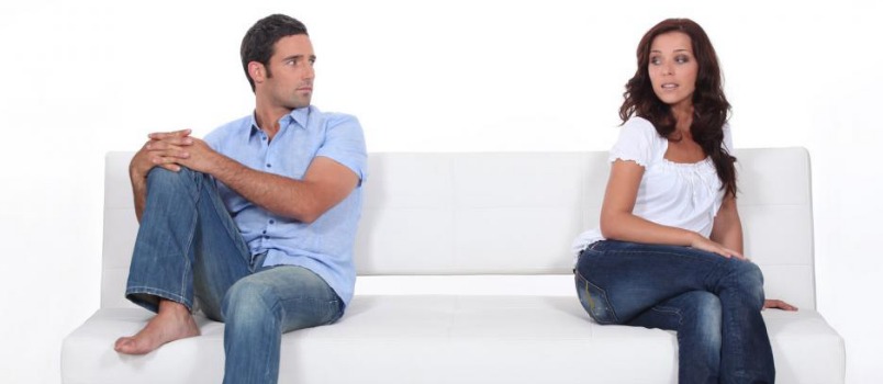 Trying To Separate, A Couple Sitting Together And Looking Each Other With Crossed Eyes