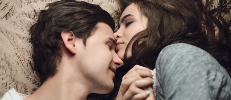 Couple laying on bed