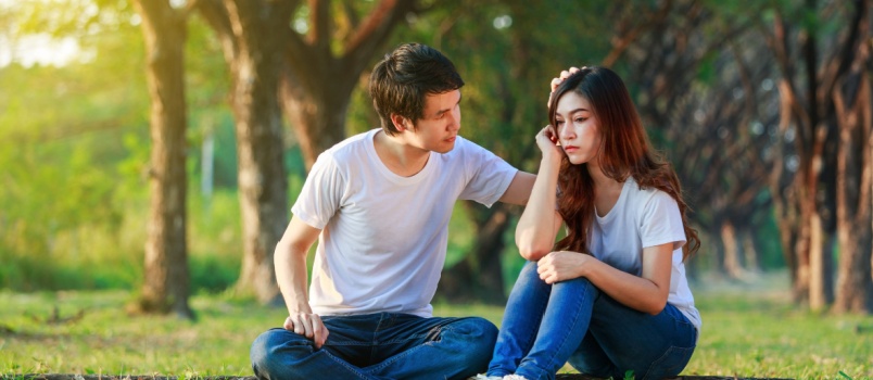 Man comforting woman