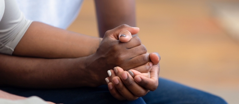 african American couple holding hands