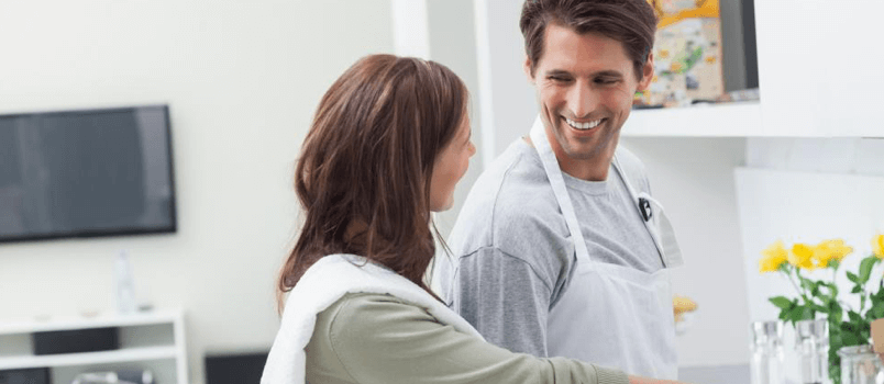 Man and woman enjoying cooking together