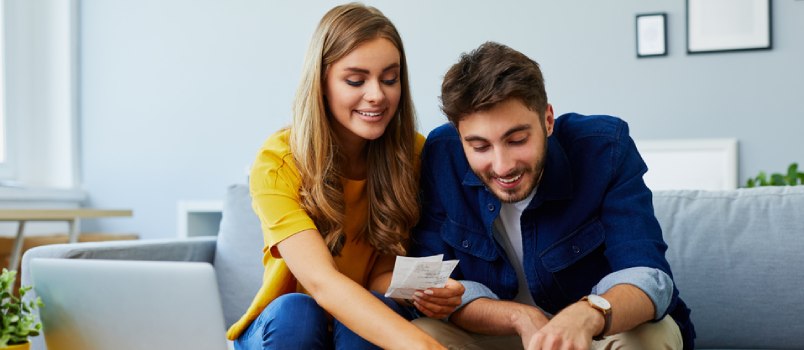 man and woman discussing their expenses