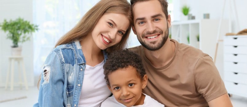 white couple with their adopted child