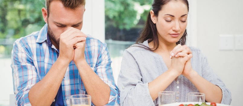 couple sitting and praying together