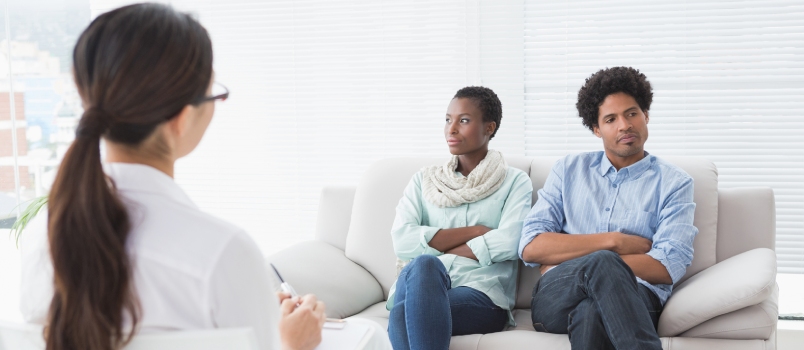 black couple sitting for a therapy session
