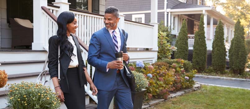 smiling black couple going to work