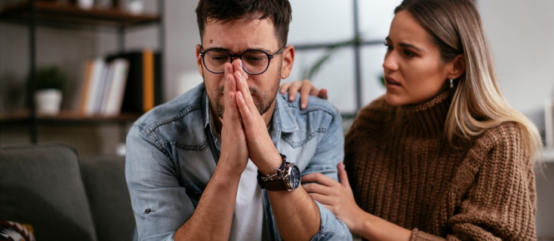 Young Man Having a Problem. Girlfriend Comforting Her Sad Boyfriend.
