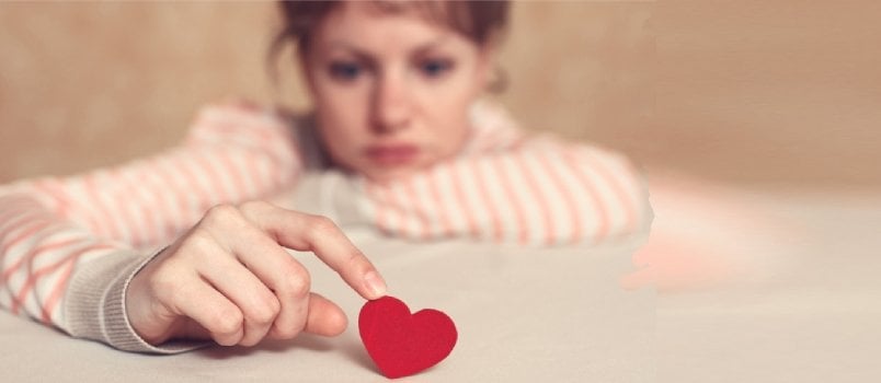 Woman Is Thinking About Unrequited Love and Relations Difficulties. Focus Is on Heart