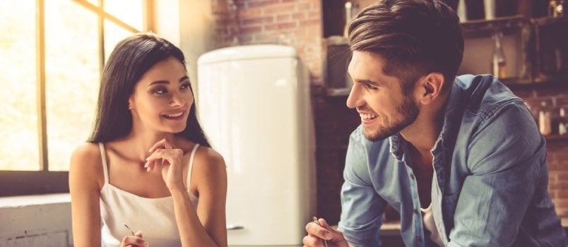 couple sitting and talking in the kitchen