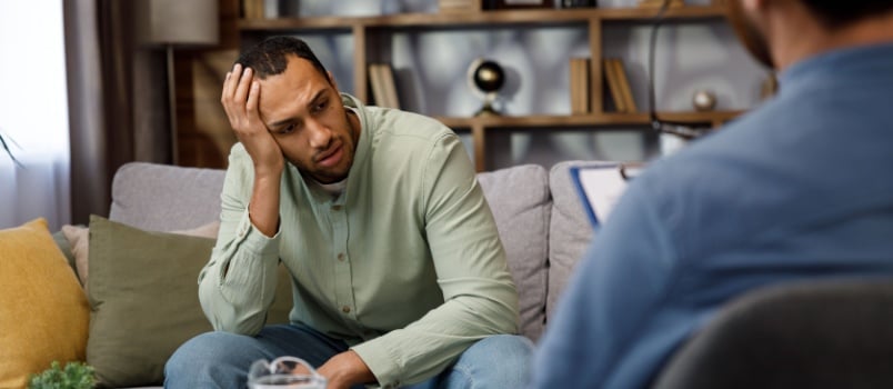 Man having counseling session with psychologist