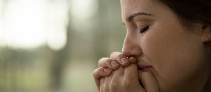 closeup of sad woman crying