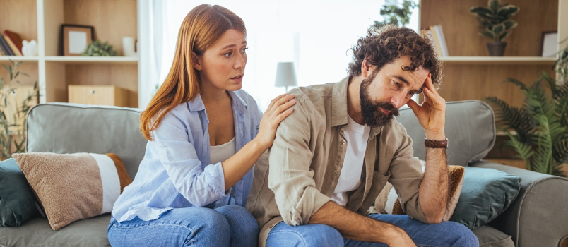 woman comforting sad man