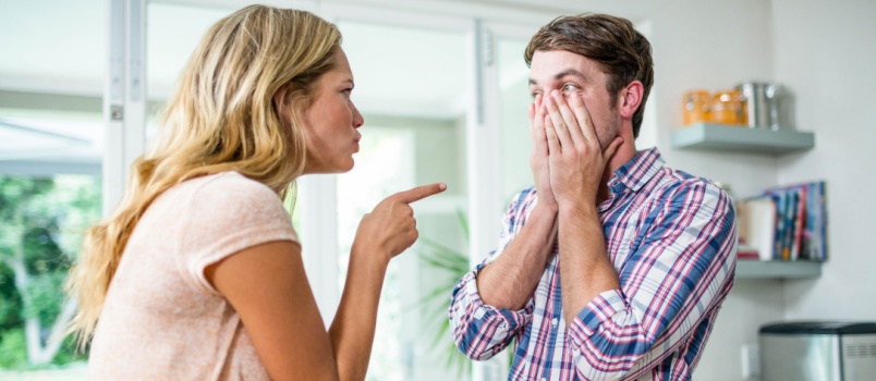 Young couple arguing in kitchen
