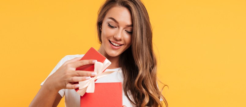 Woman opening gift box