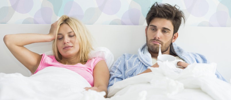 Lazy Couple Laying On Bed Together