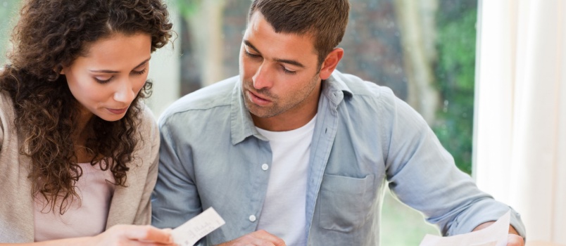 Young couple calculating finance