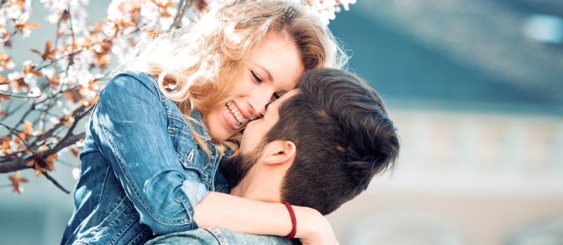 happy man and woman looking at each other 