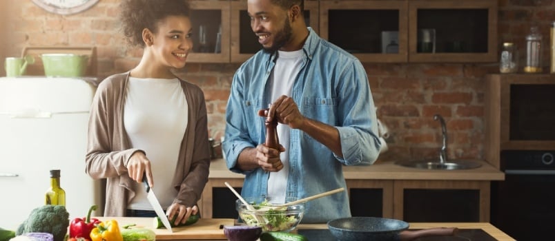 black couple cooking together