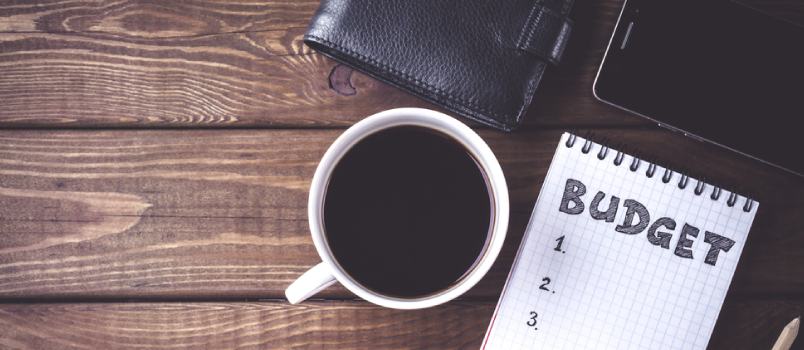 Isolated Tea Cup and Budget Note Dairy With Wallet