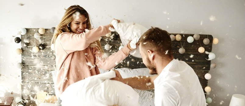 couple having a pillow fight