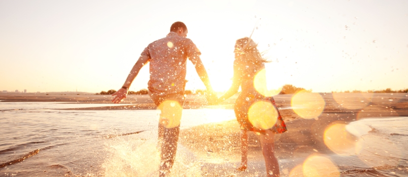 couple running on the beach