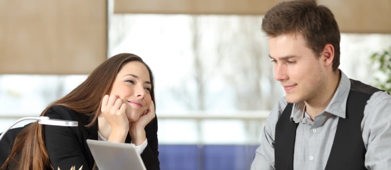 Women Watching Man In Love While Man Working On Laptop