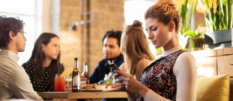 Hating your ex as a safety blanket woman using phone