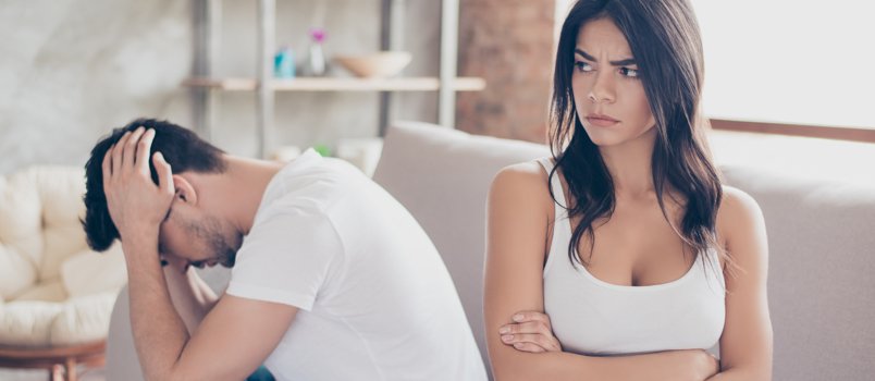 angry and defensive woman looking away from man