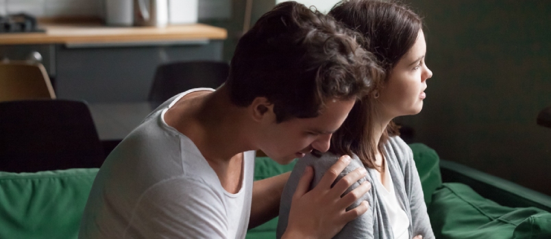 Man apologizing lovingly to his partner