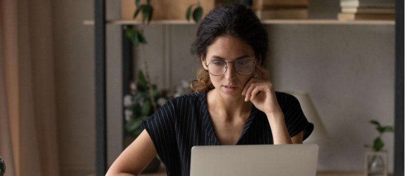 Woman looking at laptop