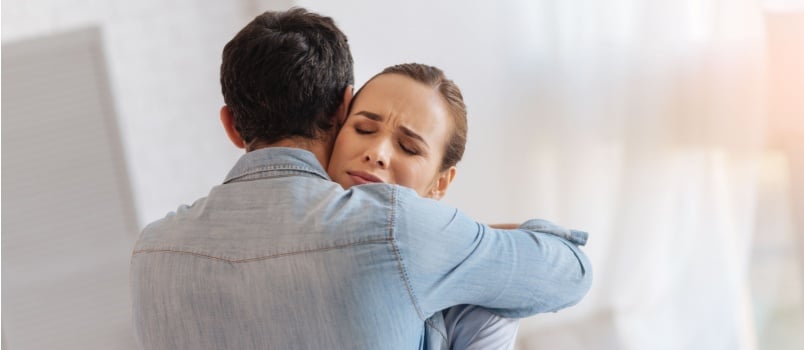 Kind couple hugging each other