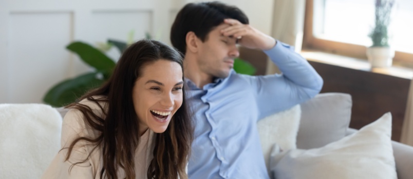 Happy woman and depressed man